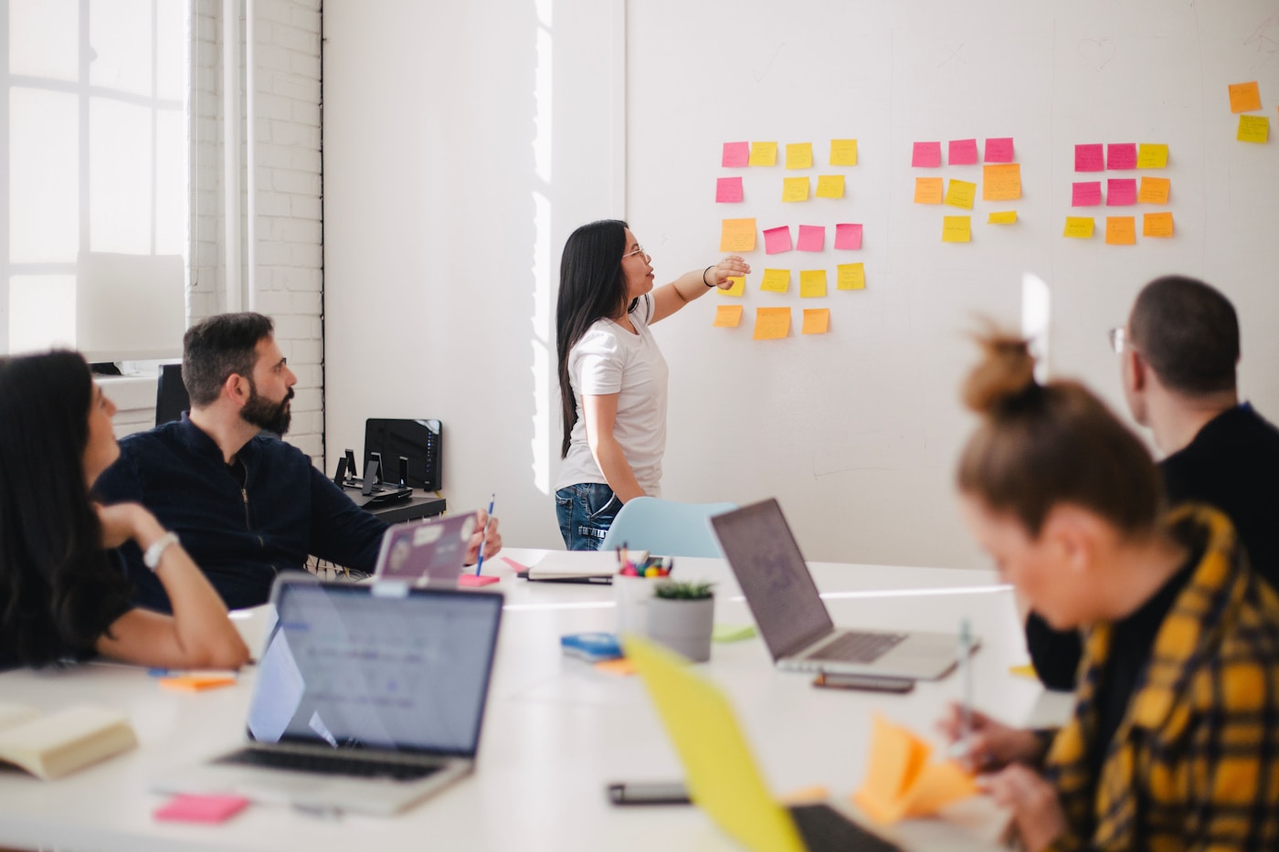 Marketing team discussing a campaign around a conference table